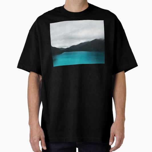 The Waters And The Wild // Vintage Retro Glowing Wilderness Mountain Lake With Cascadia Trees Covered In Fog Oversized T-Shirt for Sale by tekay